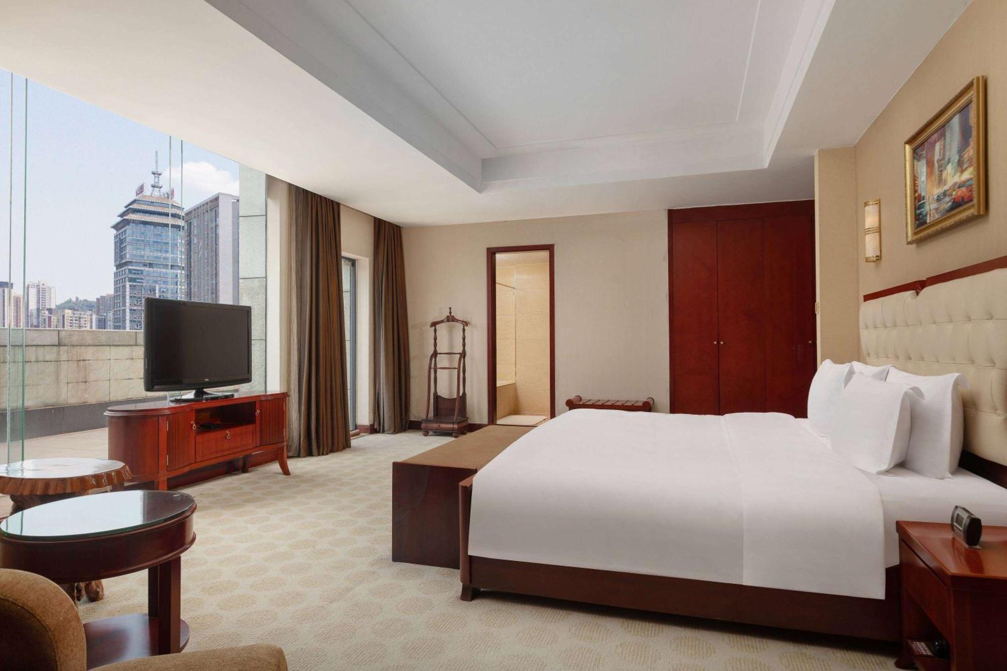 Отель Ramada Plaza By Wyndham Chongqing West Экстерьер фото